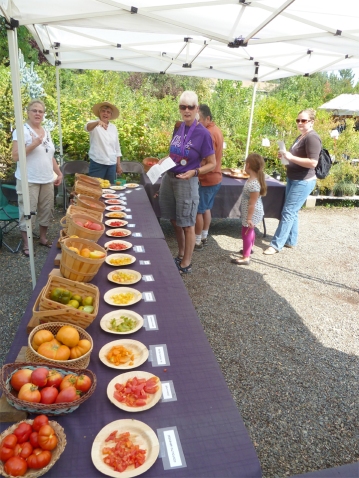 Heirloom tomatoes and happy customers at our summer Tomato Tasting
