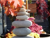 Rock sculptures, garden mums, and fall foliage